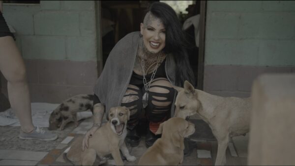 Woman petting dogs at Nicaraguan Animal Rescue