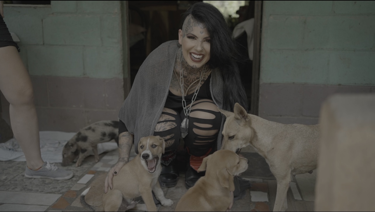 Woman petting dogs at Nicaraguan Animal Rescue